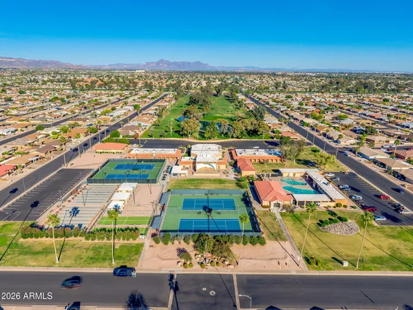 an aerial view of residential houses with outdoor space