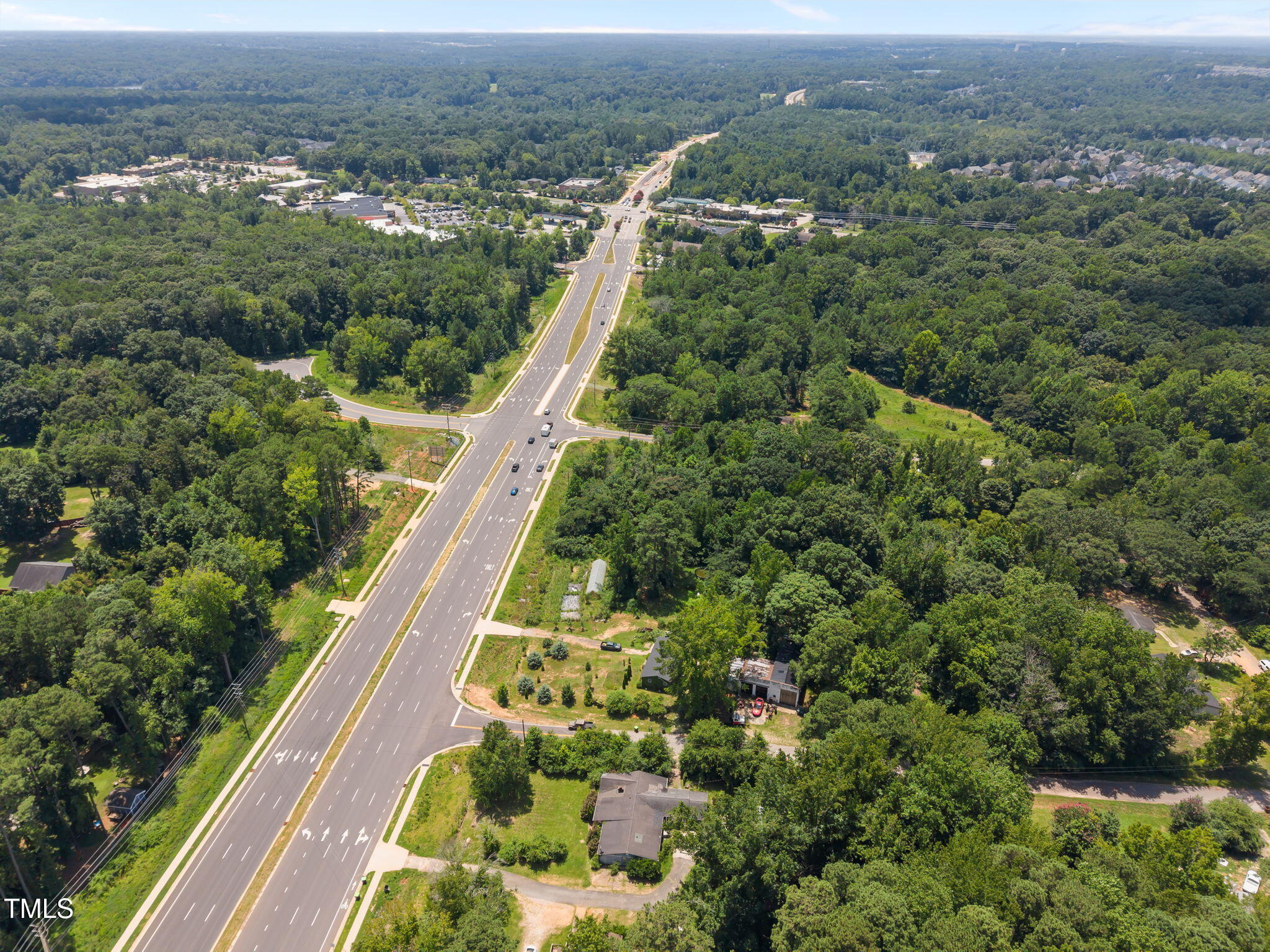 9640 Holly Springs Road Apex, NC 27539 - Photo 12 of 23 an aerial view of residential houses with outdoor space and trees