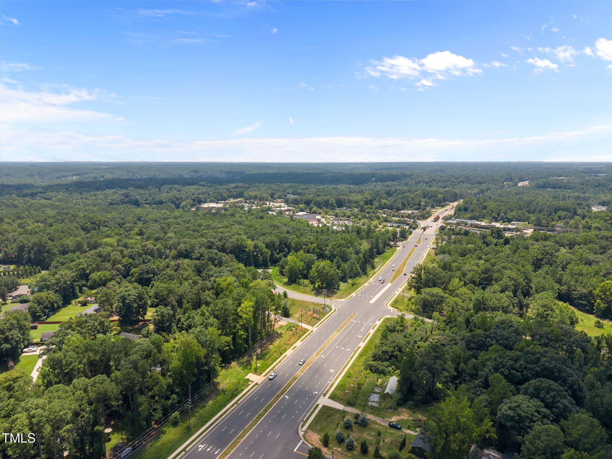 9640 Holly Springs Road Apex, NC 27539 - Photo 15 of 23 a view of a city from a balcony with an outdoor space