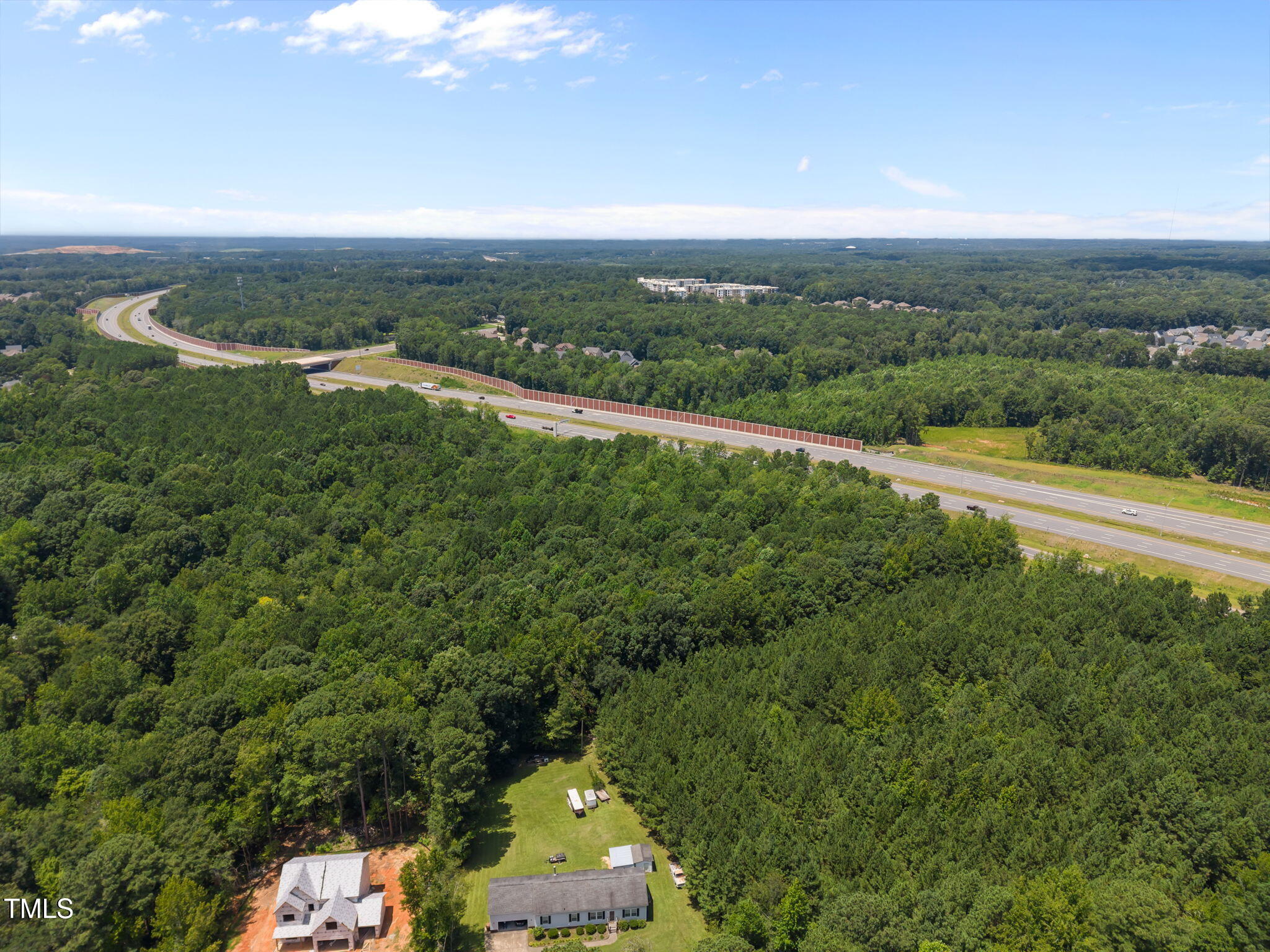 9640 Holly Springs Road Apex, NC 27539 - Photo 20 of 23 an aerial view of a houses with a yard