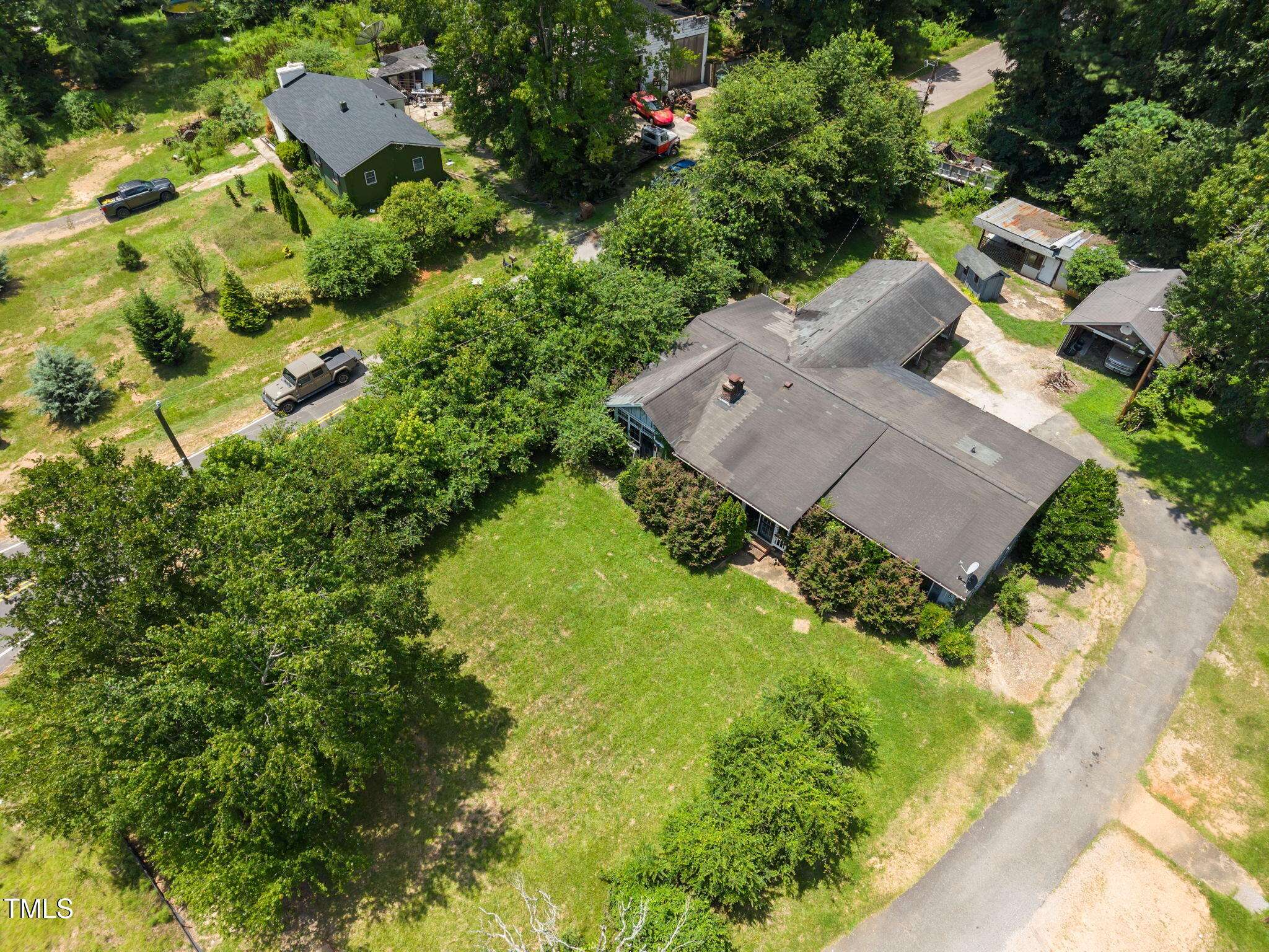 9640 Holly Springs Road Apex, NC 27539 - Photo 2 of 23 an aerial view of residential house with outdoor space and trees all around