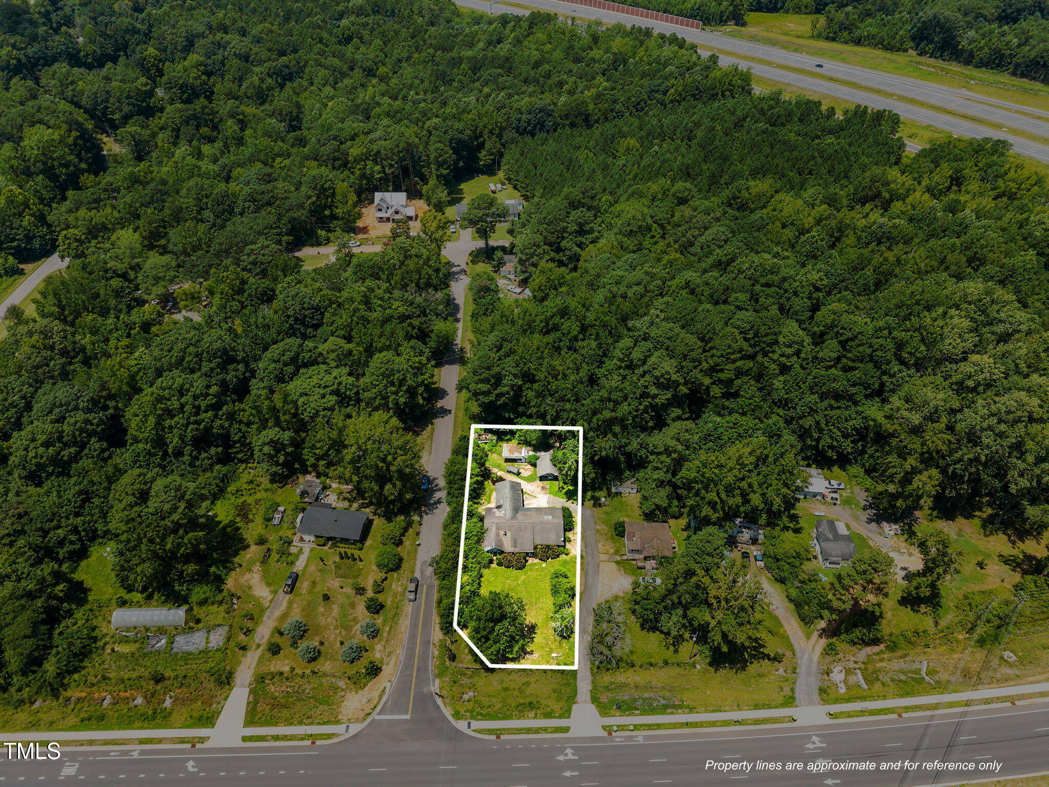 9640 Holly Springs Road Apex, NC 27539 - Photo 7 of 23 an aerial view of a residential houses with yard