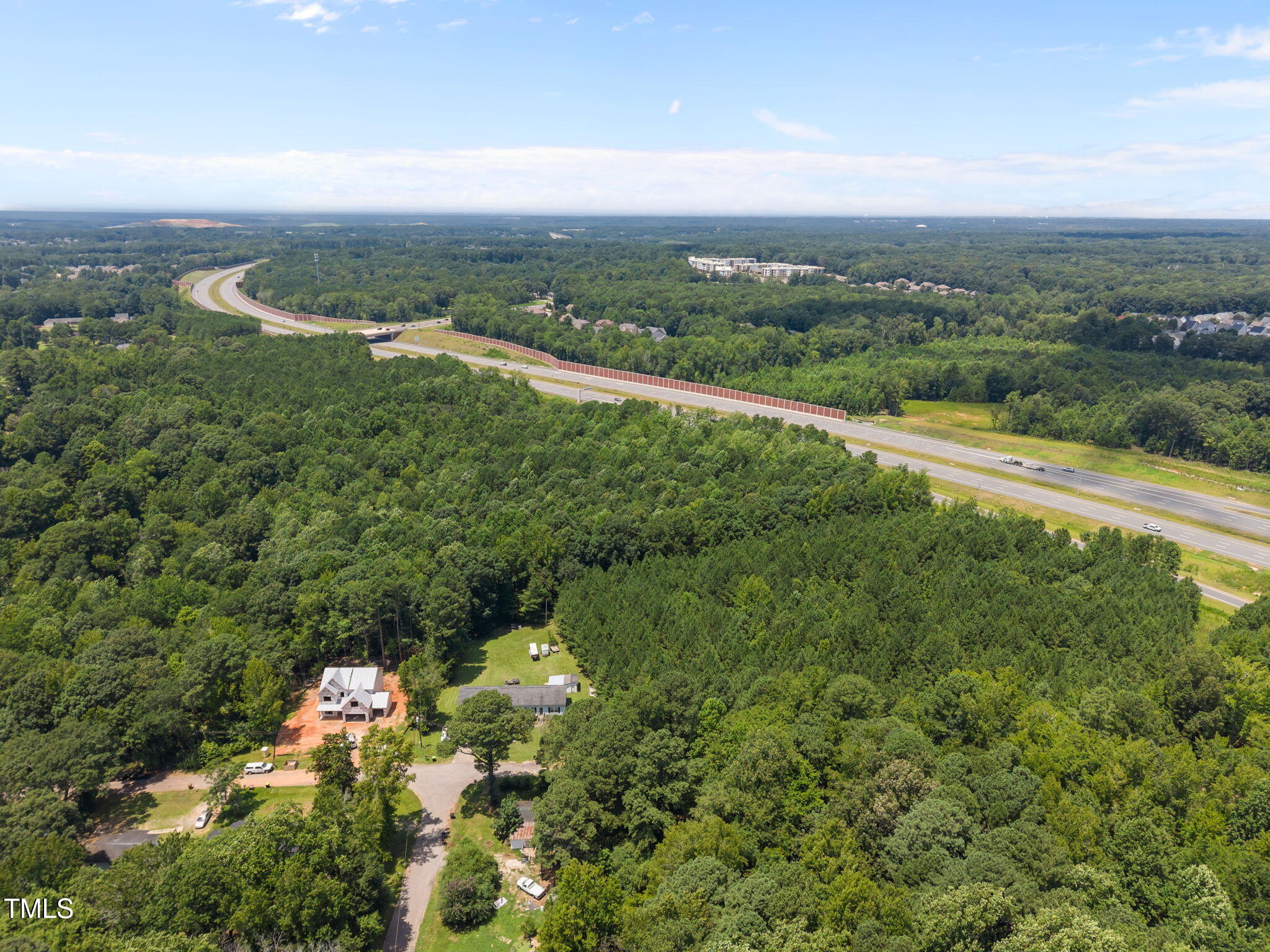 9640 Holly Springs Road Apex, NC 27539 - Photo 9 of 23 an aerial view of residential houses with outdoor space and trees