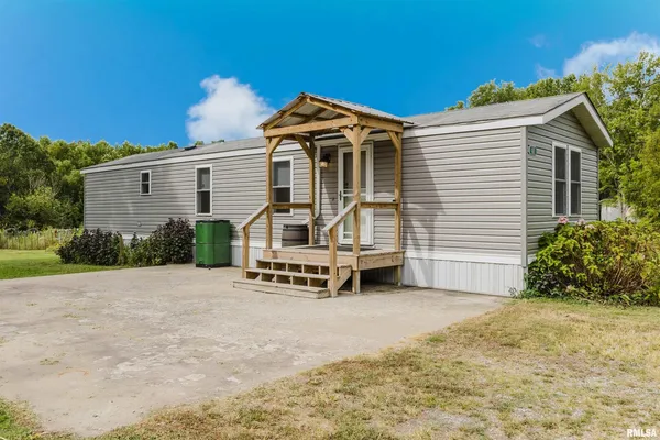 a view of a car park in front of house