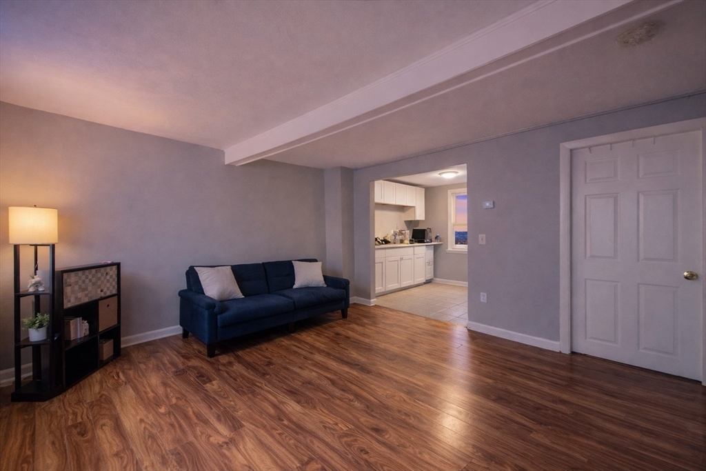 23 Whitehall Street Providence, RI 02909 - Photo 5 of 7 a living room with furniture and a wooden floor