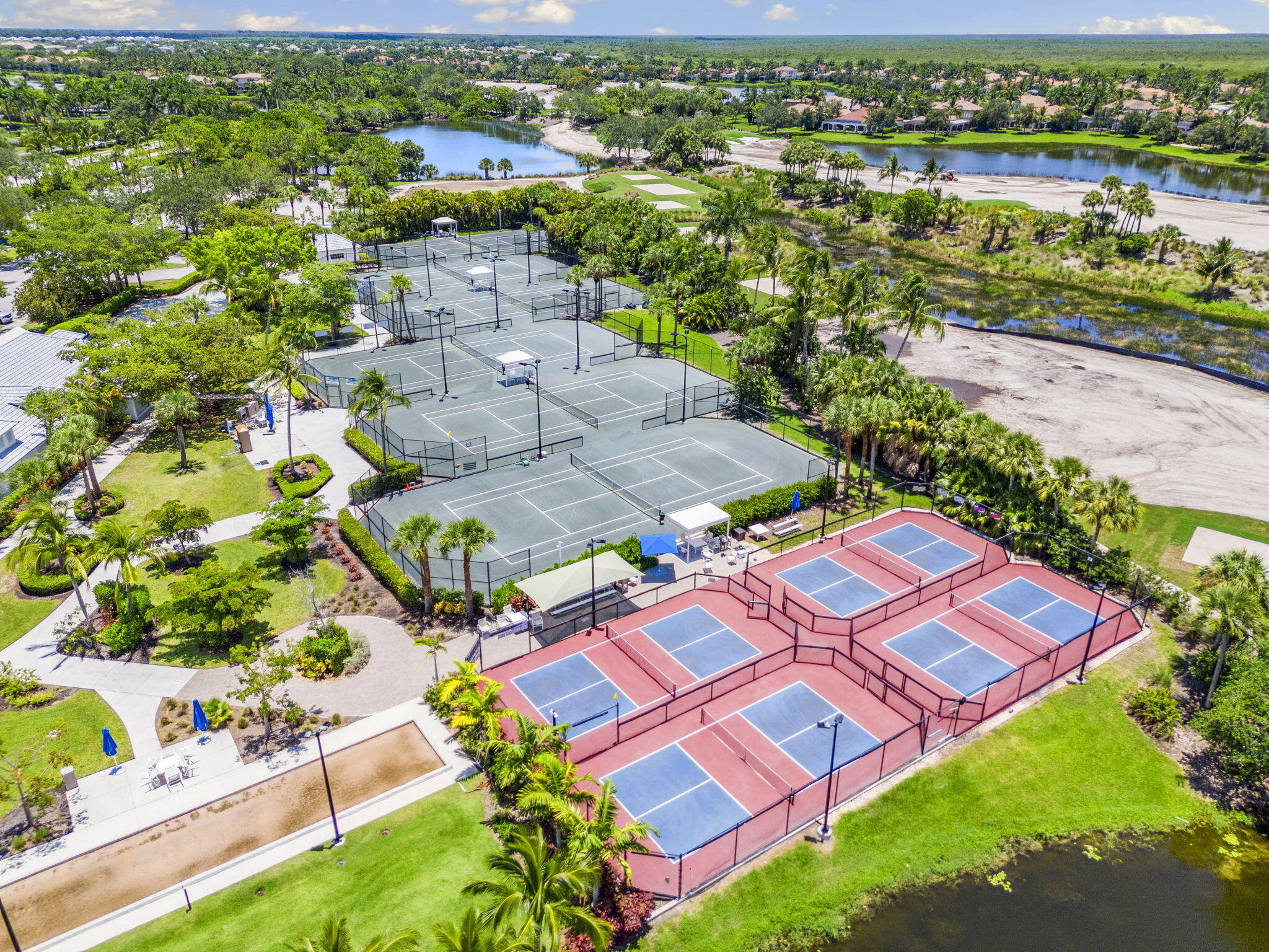 9213 Museo Circle, Unit 103 Naples, FL 34114 - Photo 37 of 47 an aerial view of residential houses with outdoor space and street view