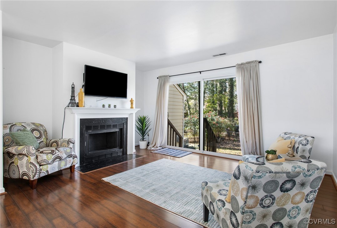 9616 Tree Line Terrace Chesterfield, VA 23832 - Photo 4 of 25 Spacious living room with low-maintenance wood-loo