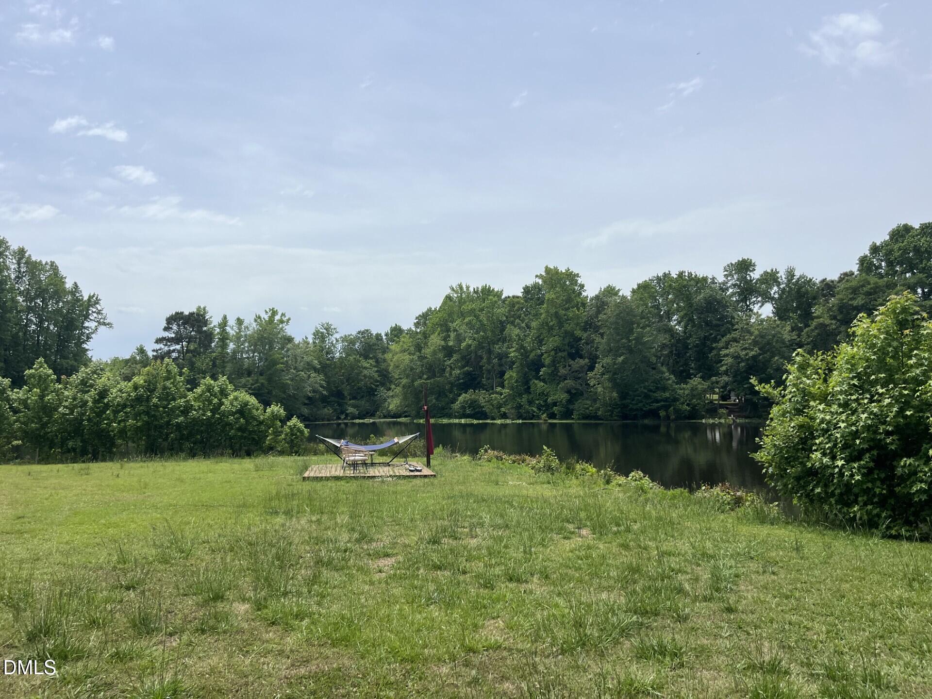 6709 Wimberly Road Willow Spring, NC 27592 - Photo 11 of 23 a view of a lake
