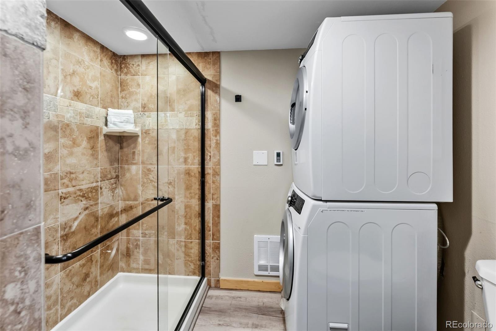 325 Four O Clock Road, Unit B103 Breckenridge, CO 80424 - Photo 13 of 19 a bathroom with a bathtub and a shower