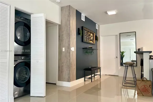 a view of a hallway with washer and dryer