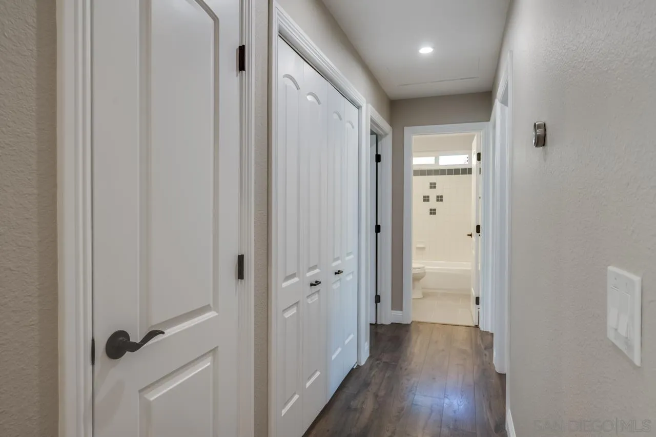10224 Pebble Beach Drive Santee, CA 92071 - Photo 13 of 30 a view of a hallway with wooden floor