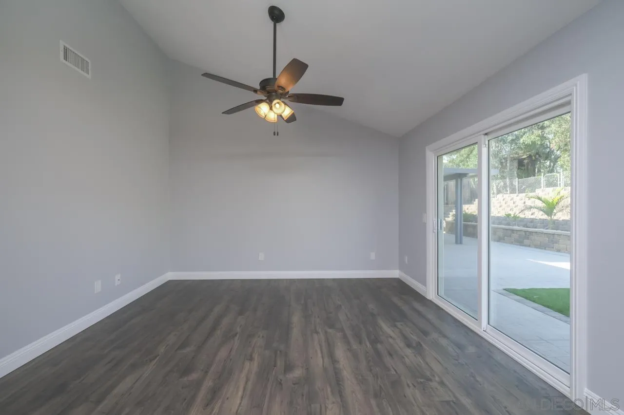 10224 Pebble Beach Drive Santee, CA 92071 - Photo 15 of 30 a view of empty room with wooden floor and fan