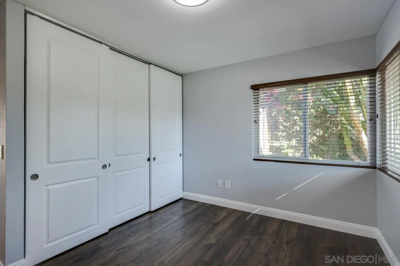 10224 Pebble Beach Drive Santee, CA 92071 - Photo 20 of 30 a view of an empty room with wooden floor and a window