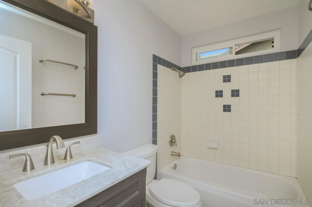 10224 Pebble Beach Drive Santee, CA 92071 - Photo 21 of 30 a bathroom with a granite countertop sink toilet and shower