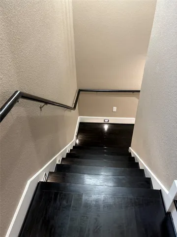 a kitchen with kitchen island granite countertop a sink and a microwave