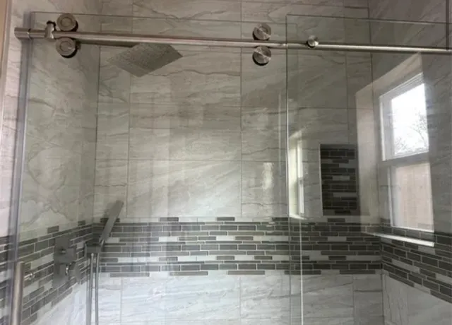 a view of a kitchen with kitchen island a sink stainless steel appliances and cabinets