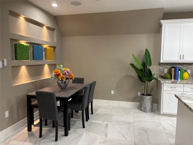a view of a dining room with furniture