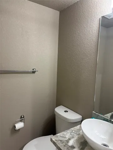 a view of a hallway with stairs