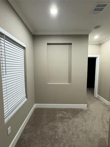 a kitchen with a granite countertop sink and a mirror