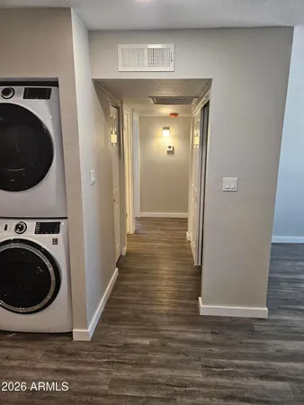 a view of a hallway with washer and dryer