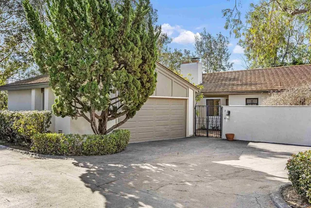 a view of a house with a tree