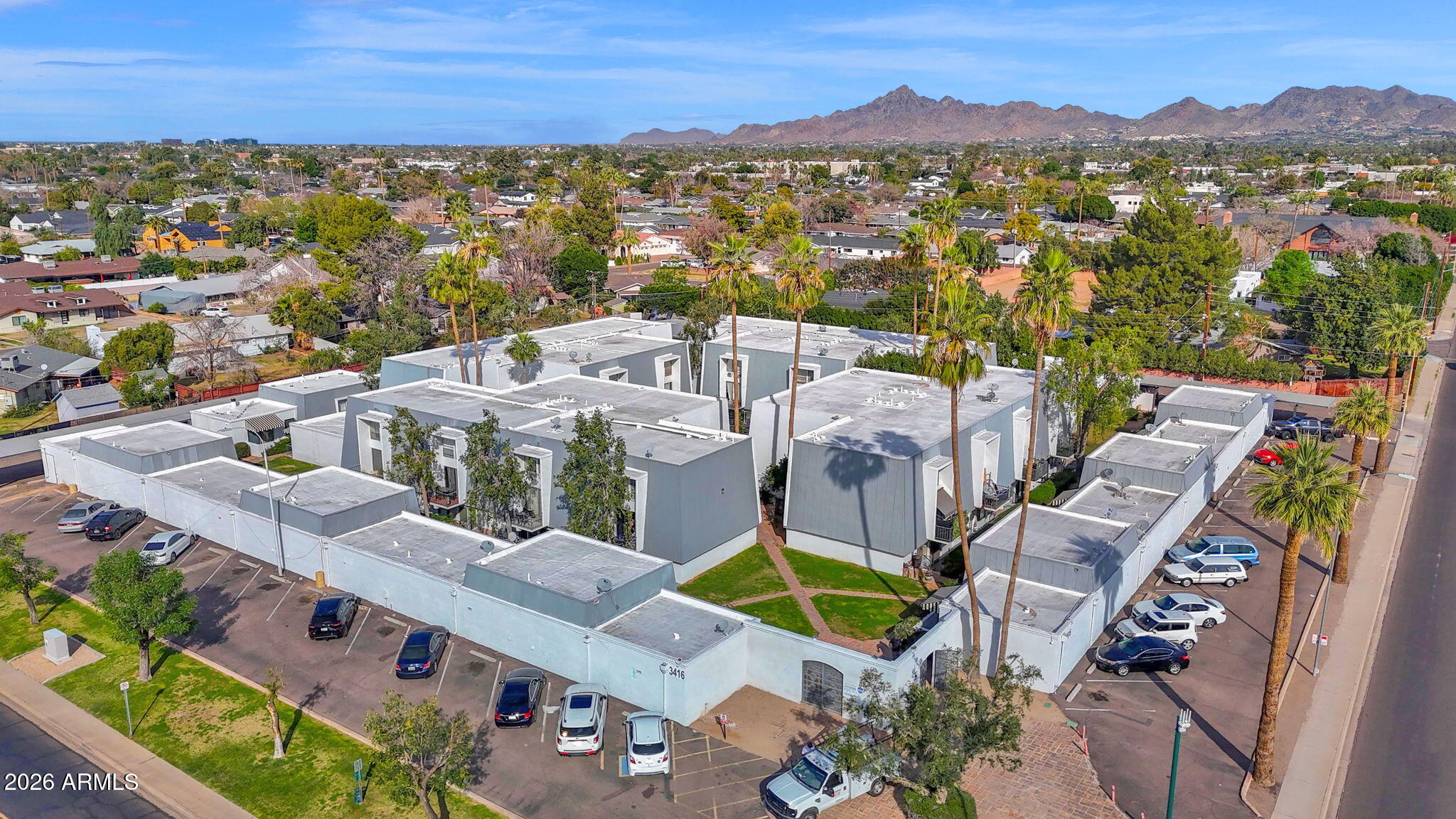 3416 North 44th Street, Unit 69 Phoenix, AZ 85018 - Photo 1 of 19 an aerial view of residential houses with outdoor space