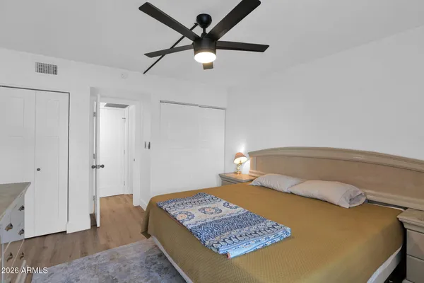 a bedroom with a bed and a table in it