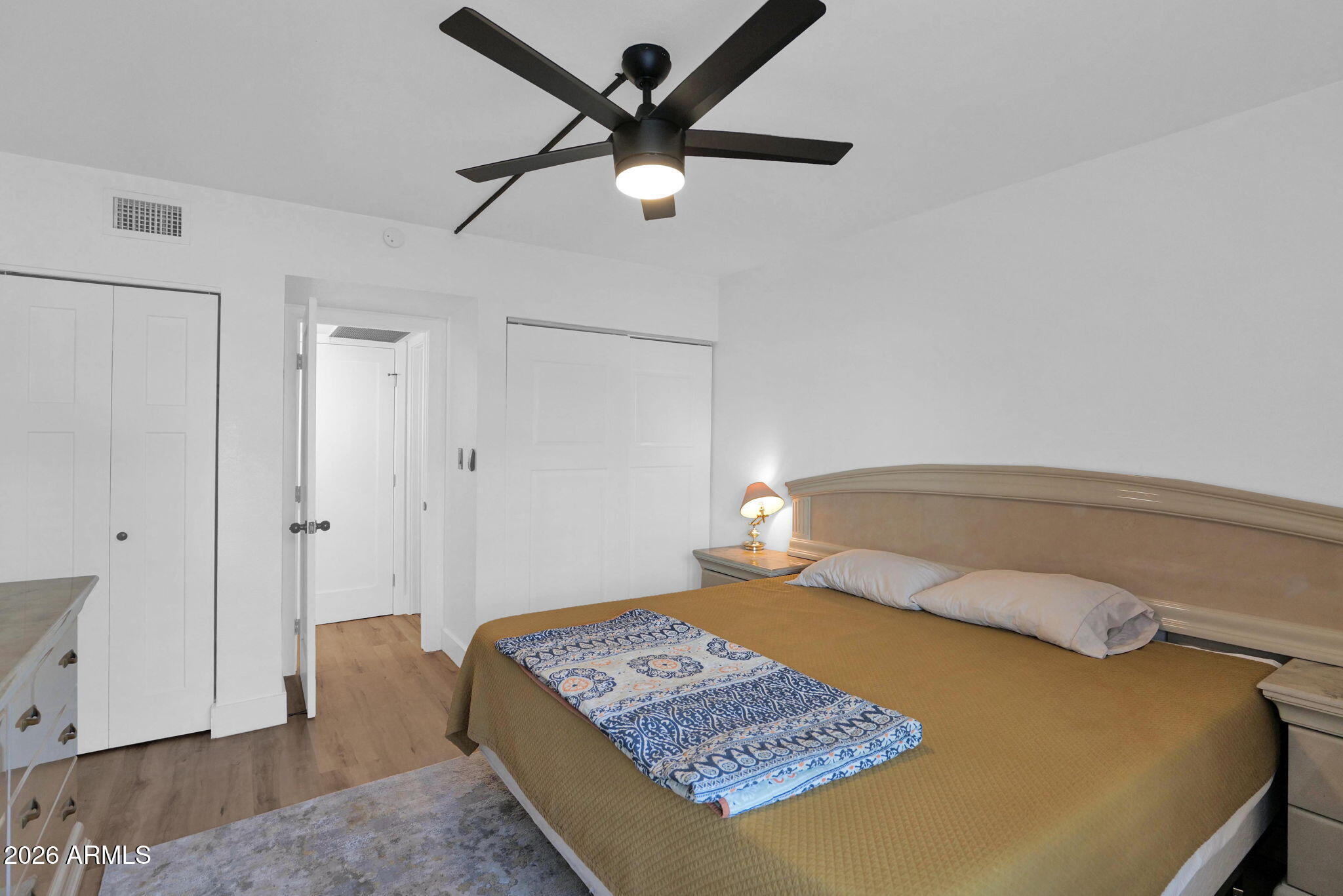 3416 North 44th Street, Unit 69 Phoenix, AZ 85018 - Photo 14 of 19 a bedroom with a bed and a table in it