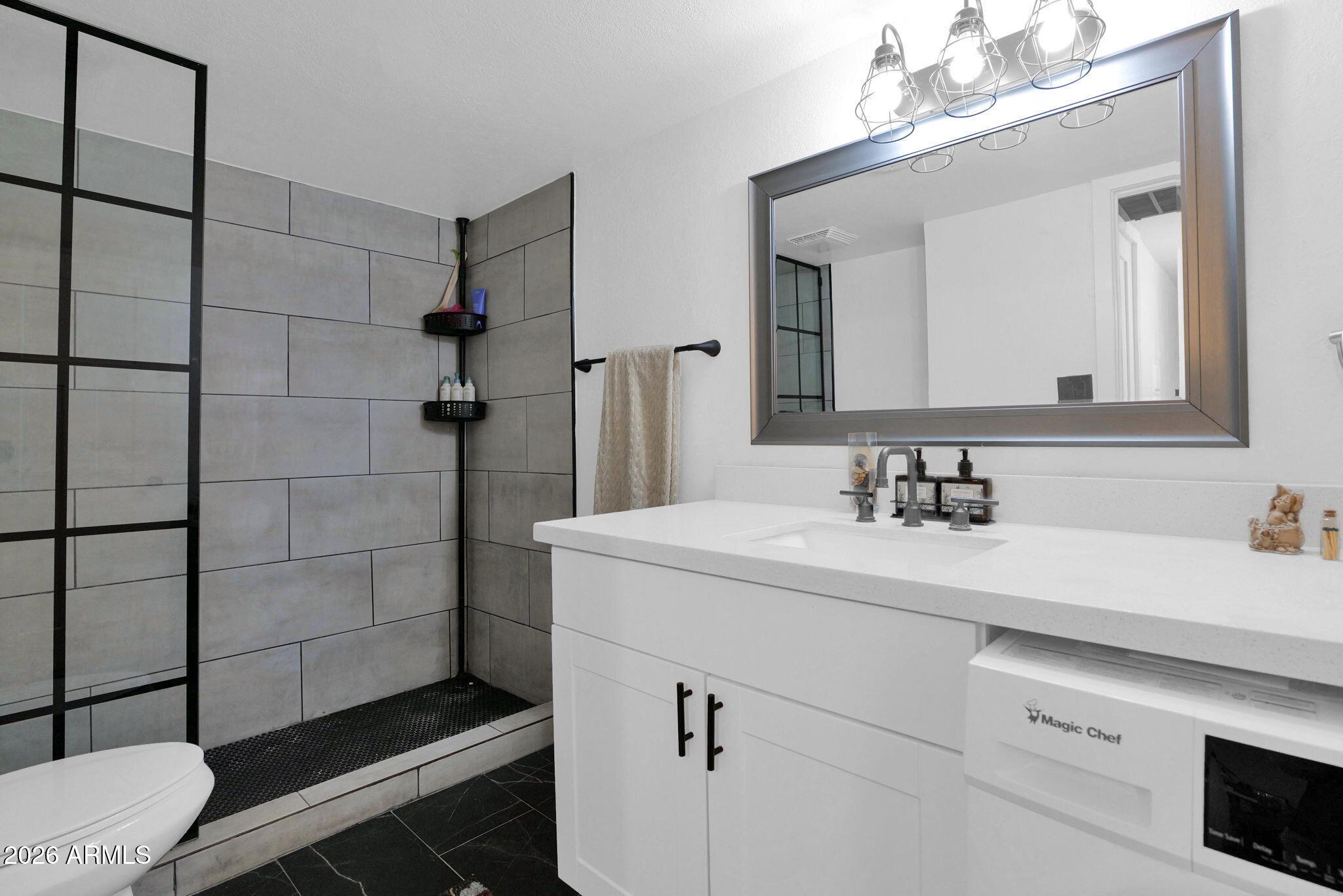 3416 North 44th Street, Unit 69 Phoenix, AZ 85018 - Photo 15 of 19 a bathroom with a sink toilet and shower