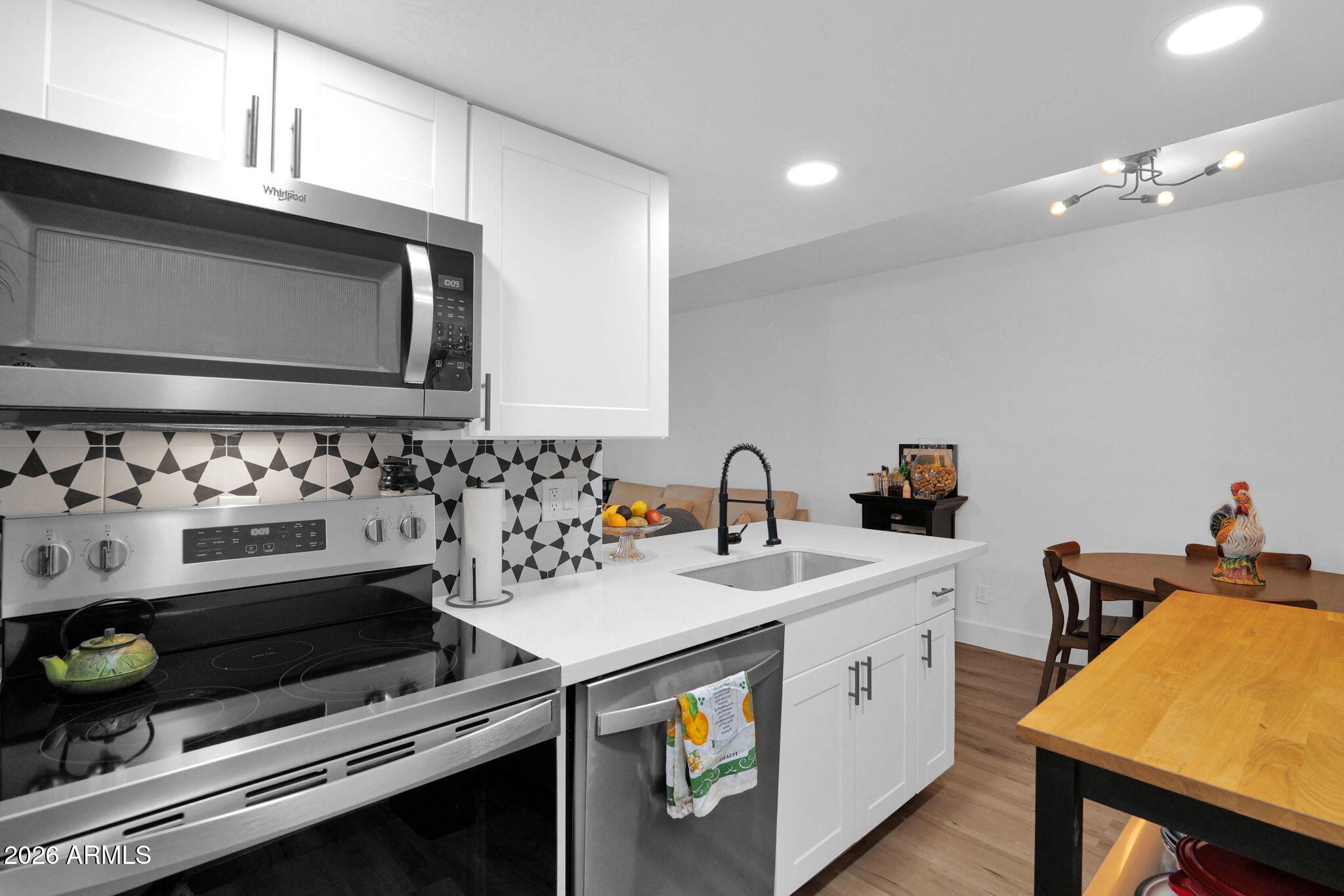 3416 North 44th Street, Unit 69 Phoenix, AZ 85018 - Photo 2 of 19 a utility room with sink dryer and washer