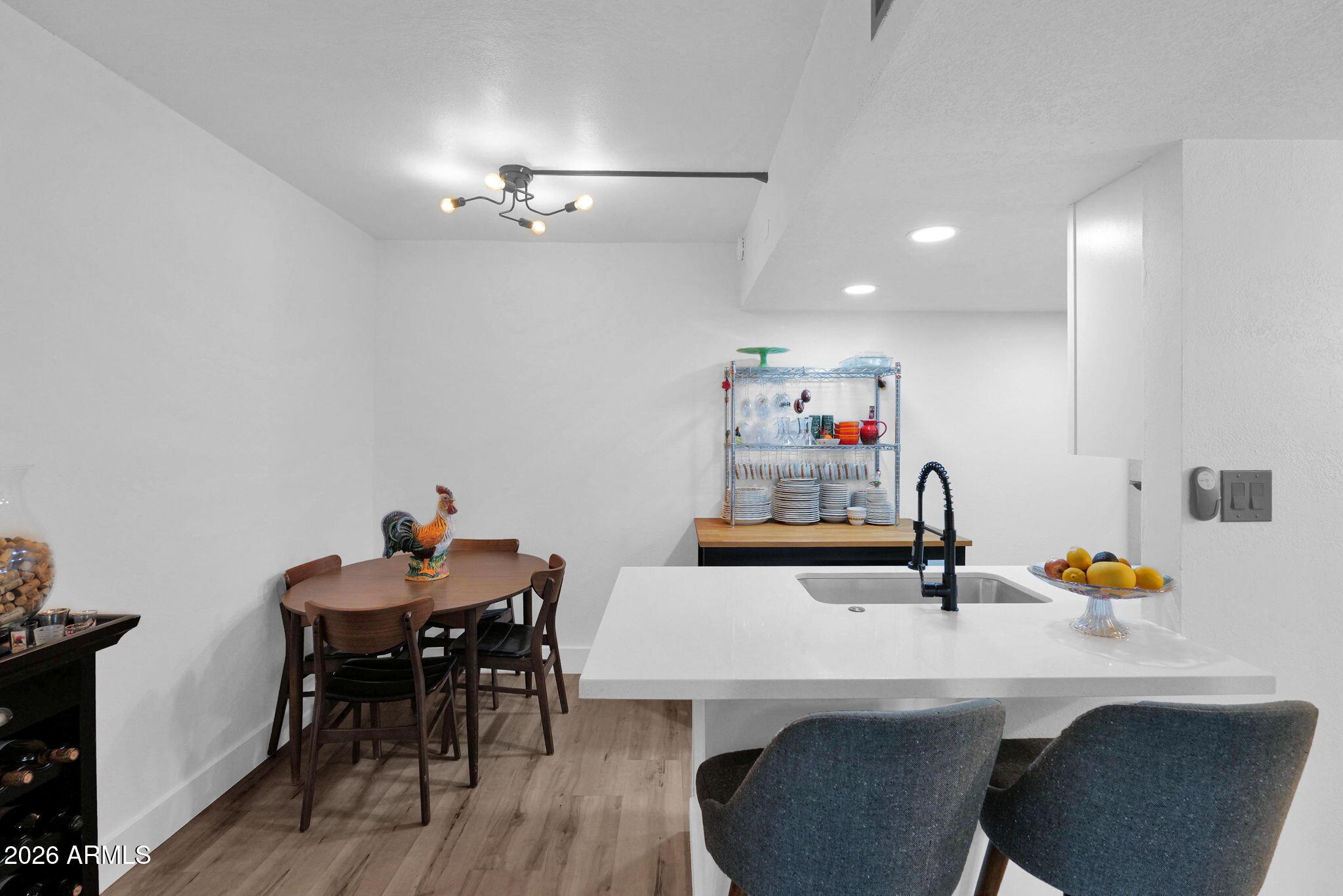 3416 North 44th Street, Unit 69 Phoenix, AZ 85018 - Photo 10 of 19 a view of a dining room with furniture and wooden floor