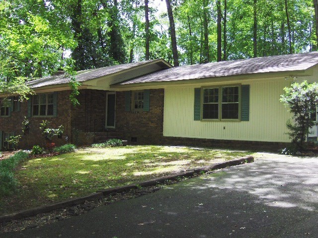4660 Arkwright Road Macon, GA 31210 - Photo 1 of 32 a backyard of a house with yard and outdoor seating