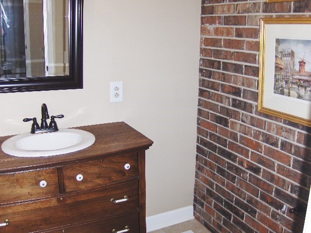 4660 Arkwright Road Macon, GA 31210 - Photo 12 of 32 a bathroom with a sink and a mirror
