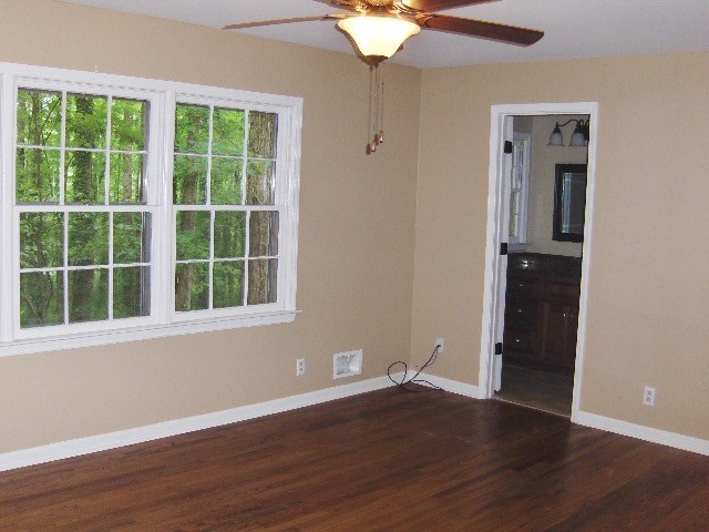 4660 Arkwright Road Macon, GA 31210 - Photo 13 of 32 a view of an empty room with wooden floor and a window
