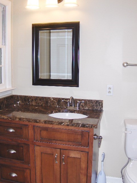 4660 Arkwright Road Macon, GA 31210 - Photo 15 of 32 a bathroom with a granite countertop sink and a toilet