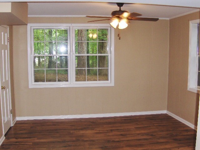 4660 Arkwright Road Macon, GA 31210 - Photo 23 of 32 a view of empty room with wooden floor and fan