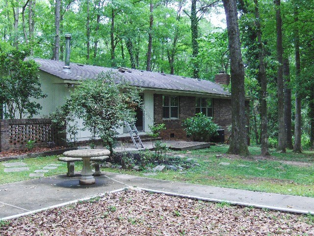 4660 Arkwright Road Macon, GA 31210 - Photo 30 of 32 a view of a chair and table in backyard of the house