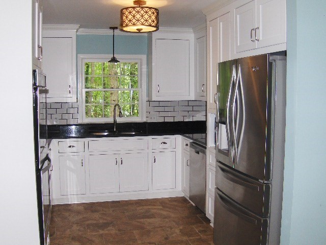 4660 Arkwright Road Macon, GA 31210 - Photo 6 of 32 a kitchen with stainless steel appliances a refrigerator and a sink