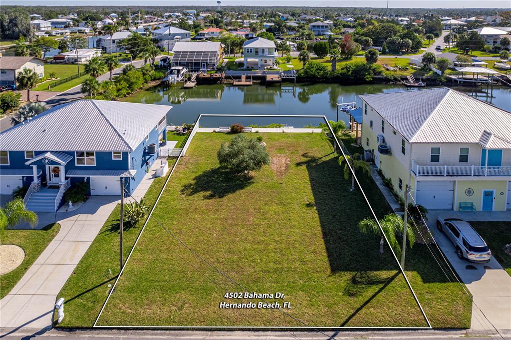 4502 Bahama Drive Hernando Beach, FL 34607 - Photo 13 of 28 an aerial view of a house with swimming pool