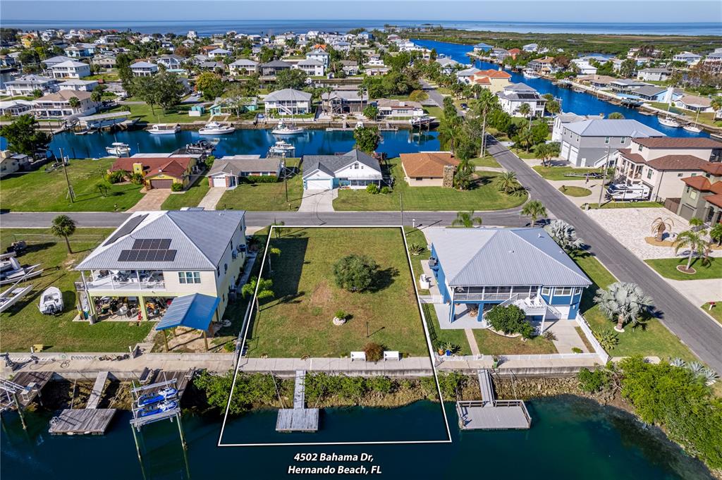 4502 Bahama Drive Hernando Beach, FL 34607 - Photo 16 of 28 an aerial view of residential houses and outdoor space