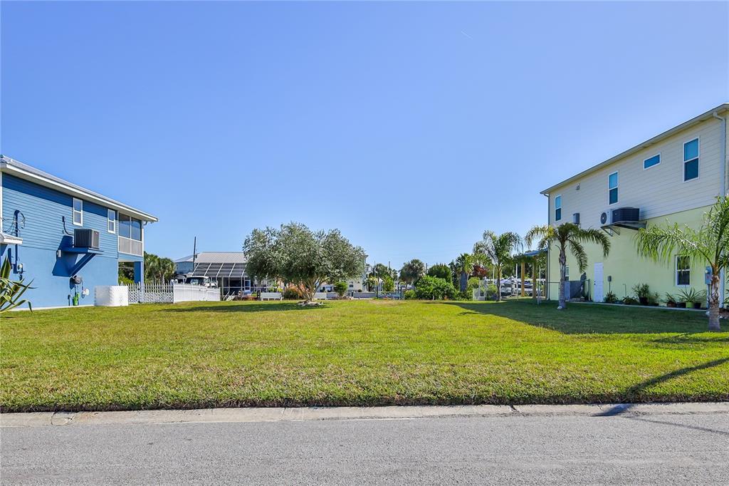 4502 Bahama Drive Hernando Beach, FL 34607 - Photo 17 of 28 a view of a swimming pool with a yard