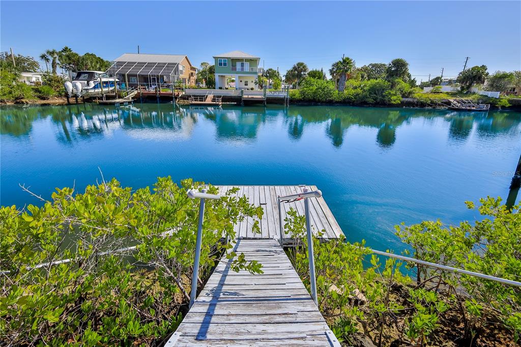4502 Bahama Drive Hernando Beach, FL 34607 - Photo 18 of 28 a view of a lake with a bridge