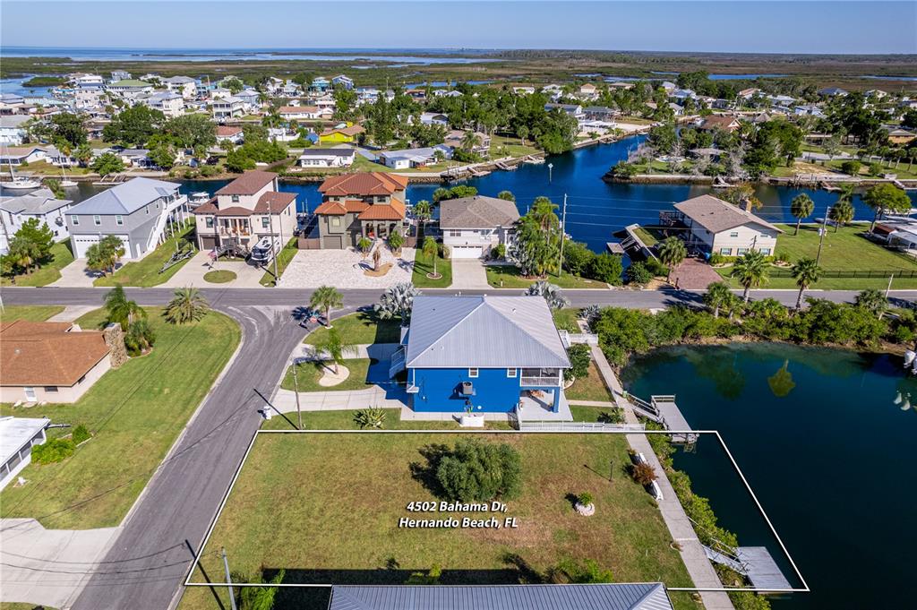 4502 Bahama Drive Hernando Beach, FL 34607 - Photo 21 of 28 an aerial view of residential houses with outdoor space