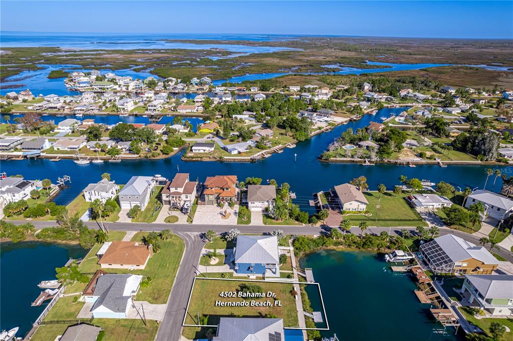 4502 Bahama Drive Hernando Beach, FL 34607 - Photo 23 of 28 an aerial view of residential houses with outdoor space