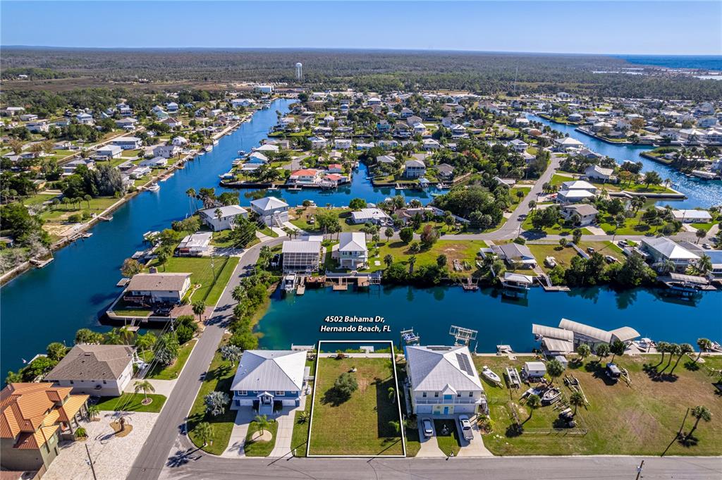 4502 Bahama Drive Hernando Beach, FL 34607 - Photo 24 of 28 an aerial view of residential houses with outdoor space