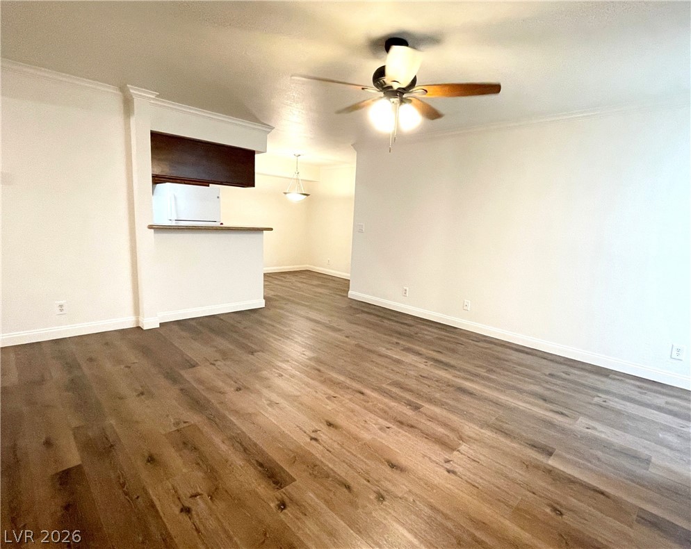 3135 South Mojave Road, Unit 221 Las Vegas, NV 89121 - Photo 19 of 19 An open floorplan with durable flooring connects the living area and kitchen, perfect for relaxed daily life.