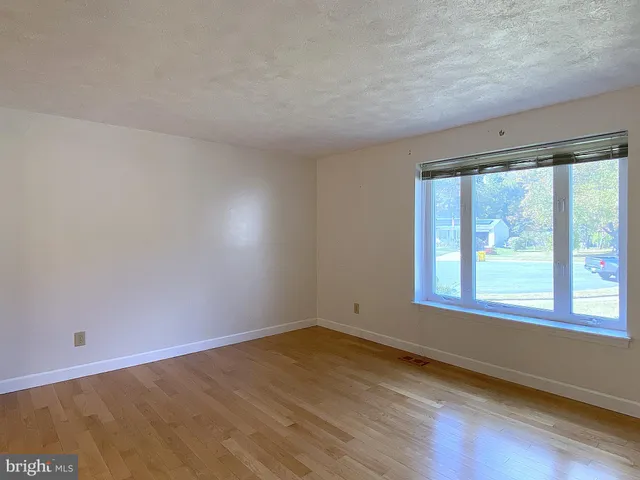 a view of a kitchen with a sink and stainless steel appliances