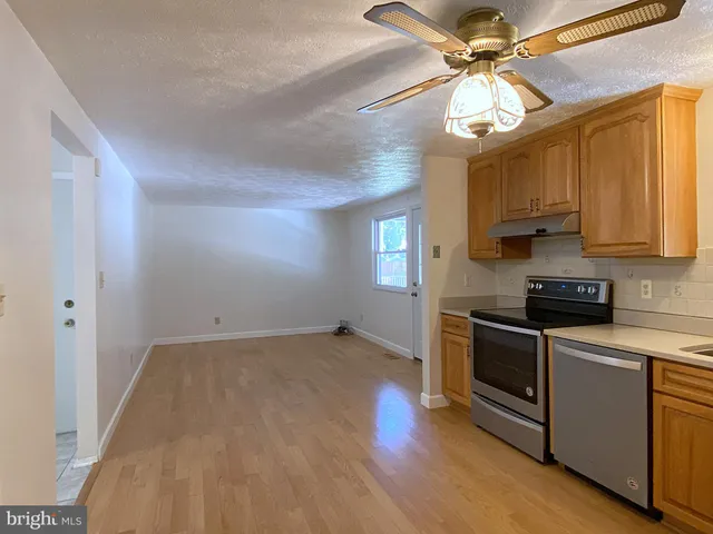 a bathroom with a sink a mirror and a vanity