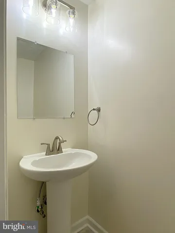 a white toilet sitting next to a bath tub and a shower