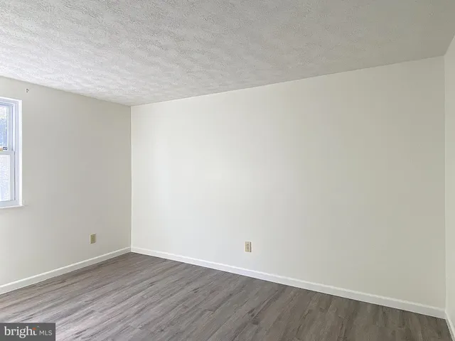 a view of a house with a backyard and porch